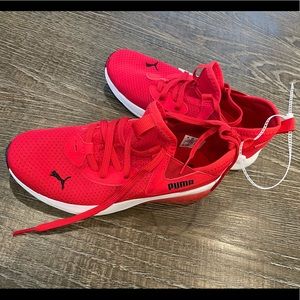 New never worn red Puma sneakers